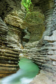 Stream flowing through banded canyon, Brent de l'Art, Venetia, Italy
