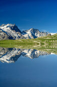 Lake Lac du Goléon with hut Refuge du Goléon and view towards Meije in Ecrins region, lake Lac du Goléon, National Park Ecrins, Dauphine, Dauphiné, Hautes Alpes, France