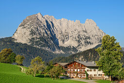 Farm with Wilder Kaiser in the background, from behind a mountain, Wilder Kaiser, Kaiser mountains, Tyrol, Austria