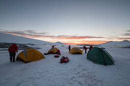 Passengers of expedition cruise ship MS Bremen (Hapag-Lloyd Cruises) set up their overnight camp on a flat stretch of well-packed snow, near Port Lockroy, Wiencke Island, Antarctica