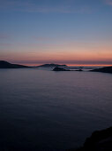 Twilight on Slea Head with a view to the Great Blasket Islands seen from while walking the Dingle Way, Slea Head, Dingle Peninsula, County Kerry, Ireland, Europe