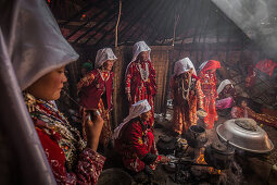 Kyrgyz women are cooking in yurt, Afghanistan, Asia