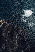 Man stands on a cliff on the island Pico, Pico, Azores, Portugal, Atlantic, Europe