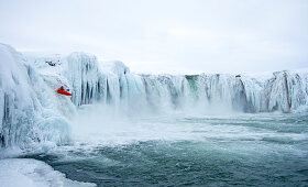 Winter kayaking on Godafoss in northern Iceland