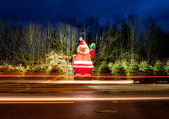 Big Santa Claus as a decoration at a Christmas tree sale, Munich, Bavaria, Germany