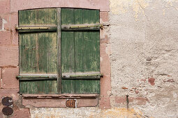 Shutters in half-timbered house in Eguisheim in Alsace, France, Europe