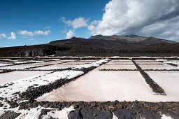 View of the salt pans at Fuencaliente, in the background the volcano of Teneguía, La Palma, Canary Islands, Spain, Europe