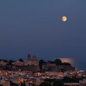 Full moon over the city of Lipari in the Aeolian Islands at night, Sicily Italy