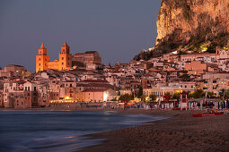 Cefalu city skyline with beach at night Sicily Italy