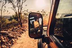 Rear-view mirror in off-road vehicle on four-wheel drive in El Questro Wilderness Park, Kimberley Region, Western Australia, Australia, Oceania;