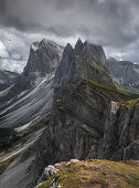 Dramatic Seceda mountainside with thick clouds in the Dolomites near Ortisei, South Tyrol