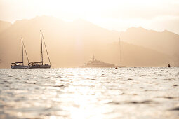 Boats and yachts in the evening light in front of Saint Florent, Corsica, France.