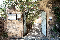 Gate entrance in the mountain village of Pigna near Calvi, Corsica, France