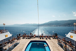 Deck chairs by the pool of the ferry off Bastia, Corsica, France.