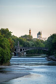 View from the Luitpoltbrücke towards the south down the Isar to the Maximiliansbrücke, the tower of the Muffathalle and the Müller'schen Volksbad, Munich, Bavaria, Germany