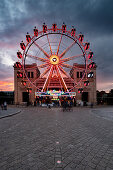 View of the ferris wheel on Koenigsplatz at sunset, Munich, Bavaria, Germany, Europe