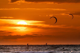 Kiting in front of the sunset, Baltic Sea, Heiligenhafen, Ostholstein, Schleswig-Holstein, Germany