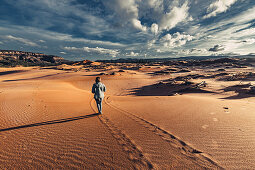 Person running in Coral Pink Sand Dunes State Park, Utah, USA, North America