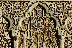 Ancient, Moorish ornamentation on the inner wall of the Alhambra, Granada, Andalusia, Spain