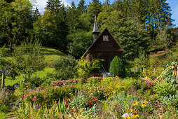 Wooden chapel and cottage garden, near St Märgen, Black Forest, Baden-Württemberg, Germany