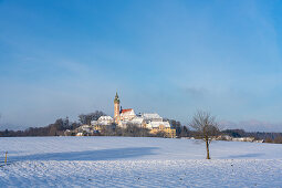 Andechs Monastery in a snowy winter landscape, Andechs, Bavaria, Germany.