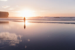 Woman walks on the beach in sunset, Portugal, beach, vacation