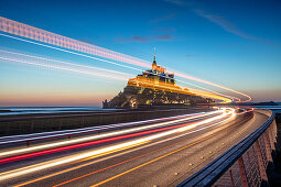 Evening view of the rocky island of Mont Saint Michel with the monastery of the same name, Normandy, France.