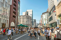 Pedestrians on a car-free Sunday on Ginza shopping street, Tokyo, Japan