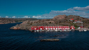 Red boat houses on the archipelago island of Tjörn in the west of Sweden