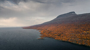 Landscape with mountains and lake in Stora Sjöfallet National Park in autumn in Lapland in Sweden from above