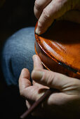 Lutist Philippe Devanneaux at work in his shop, Cremona, Italy