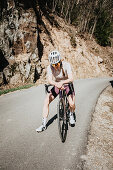 Road biking, woman riding a racing bike on the road