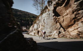 Road biking, woman riding a racing bike on the road