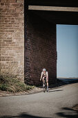 Road biking, woman riding a racing bike on the road