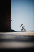 Road biking, woman riding a racing bike on the road