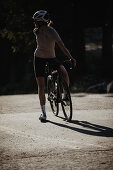 Road biking, woman riding a racing bike on the road