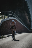 Road biking, woman riding a racing bike on the road