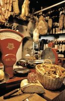 Inside an Italian Deli; Hanging Meat and a Scale