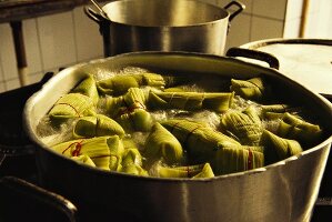 Pamonhas in pot (corn porridge in banana leaf, Brazil)