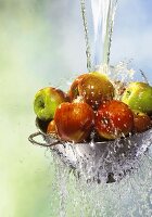 Washing apples in a strainer