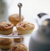 Rhubarb muffins with pine nuts on tiered stand