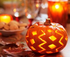 Halloween: pumpkin with carved pattern