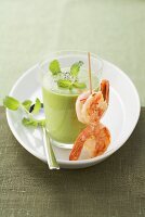 Pea soup with prawn skewer