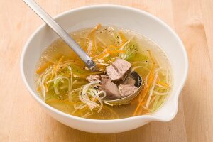 Beef broth with meat, vegetables and noodles