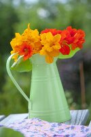 Nasturtiums in a green metal vase