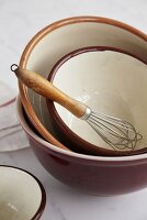 Various mixing bowls with whisk