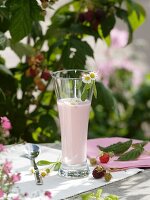 Raspberry milkshake with daisies