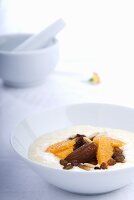 Rice pudding with dates, oranges and raisins