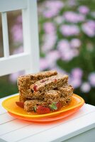 Fruity muesli bars on wooden chair