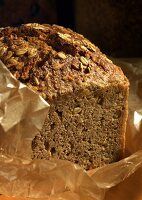 Wholemeal bread with oats on a piece of paper